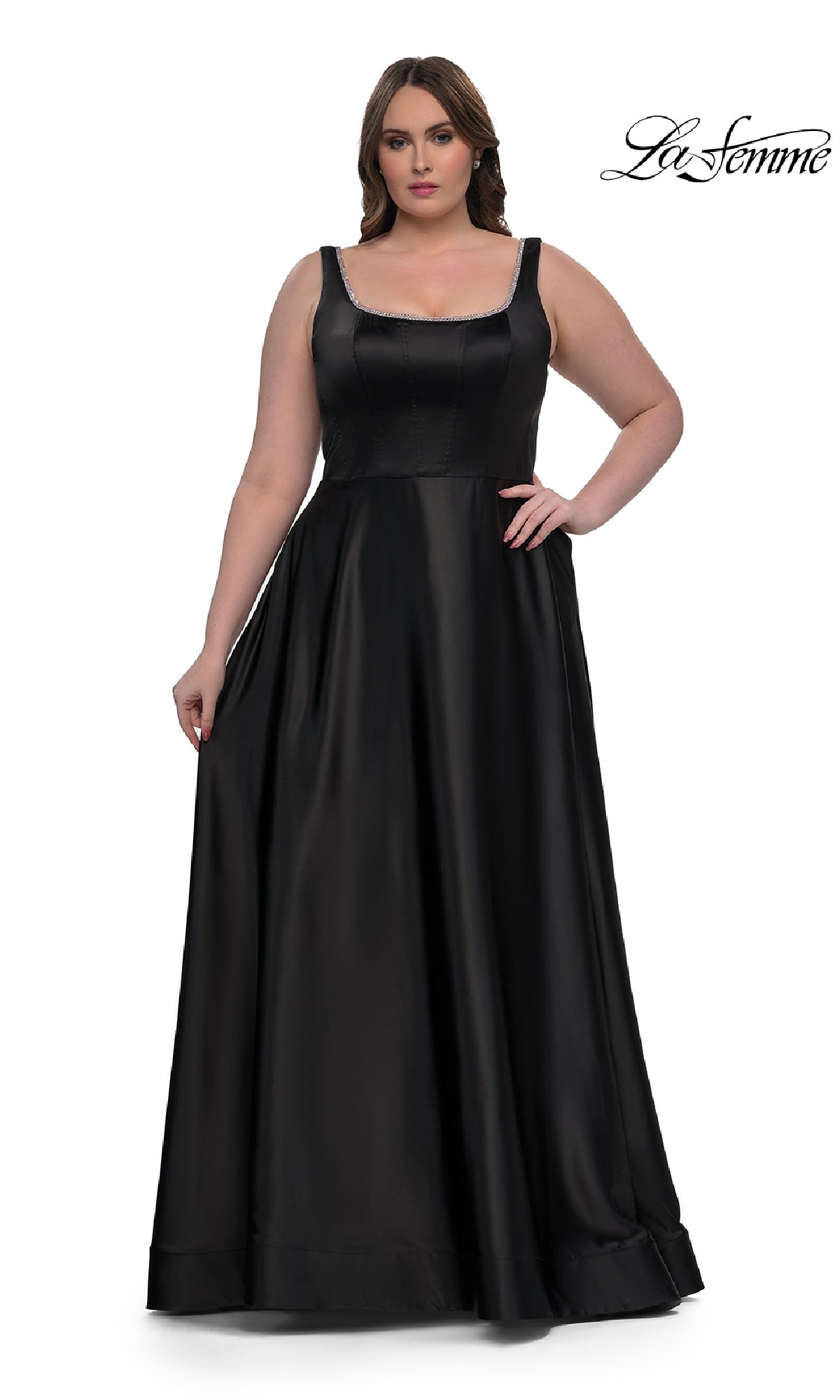 A woman wears the Plus-Size Classic Long Prom Gown, La Femme 33026—a sleeveless, floor-length black satin dress with a fitted bodice and flared skirt. The La Femme logo is in the top right corner.